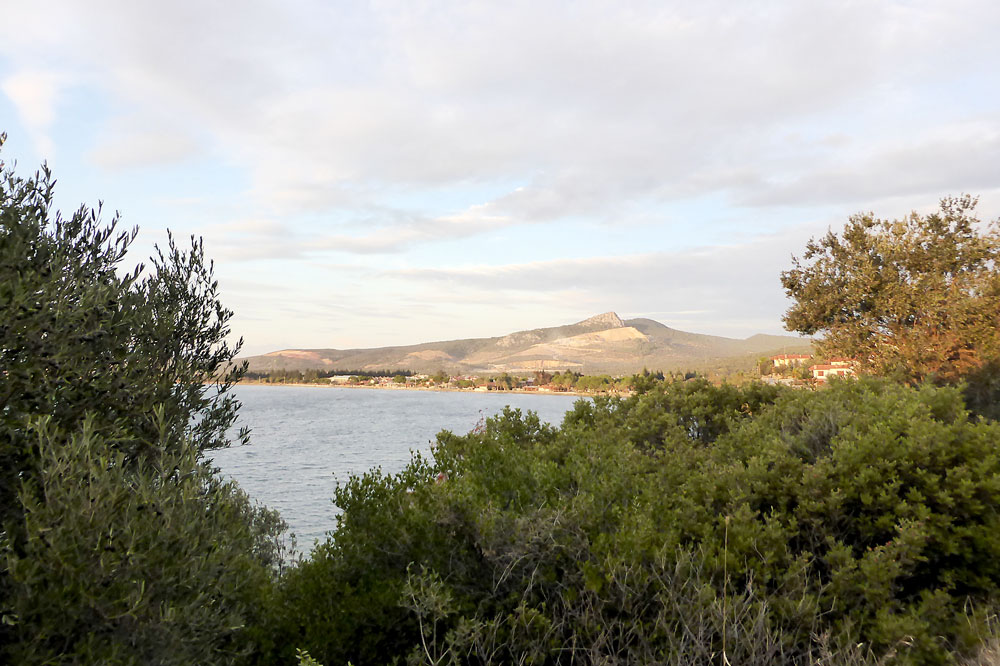 The bay of Afacan and the white peak of Sakar Dağı